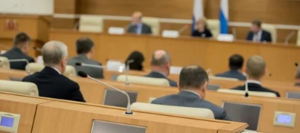 Attendees sitting at a public meeting