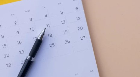 Pen on top of a calendar