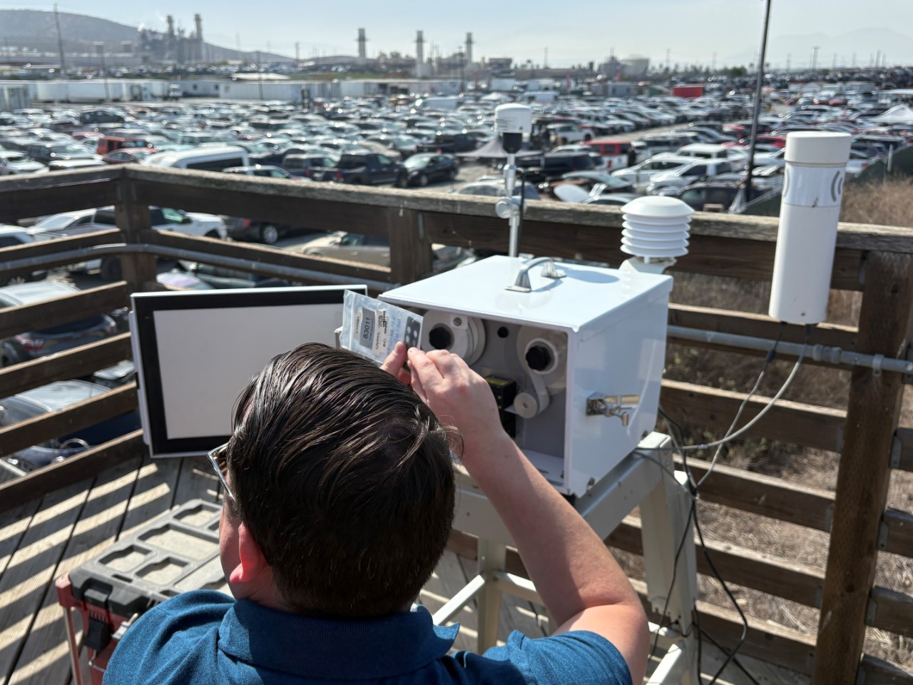 Person looking at air quality equipment