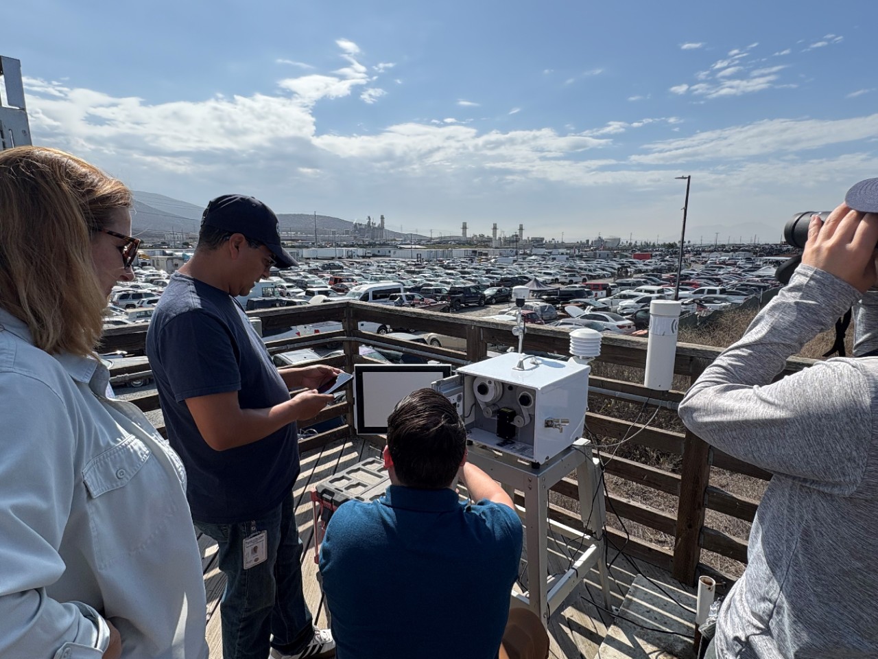 People looking at monitoring equipment