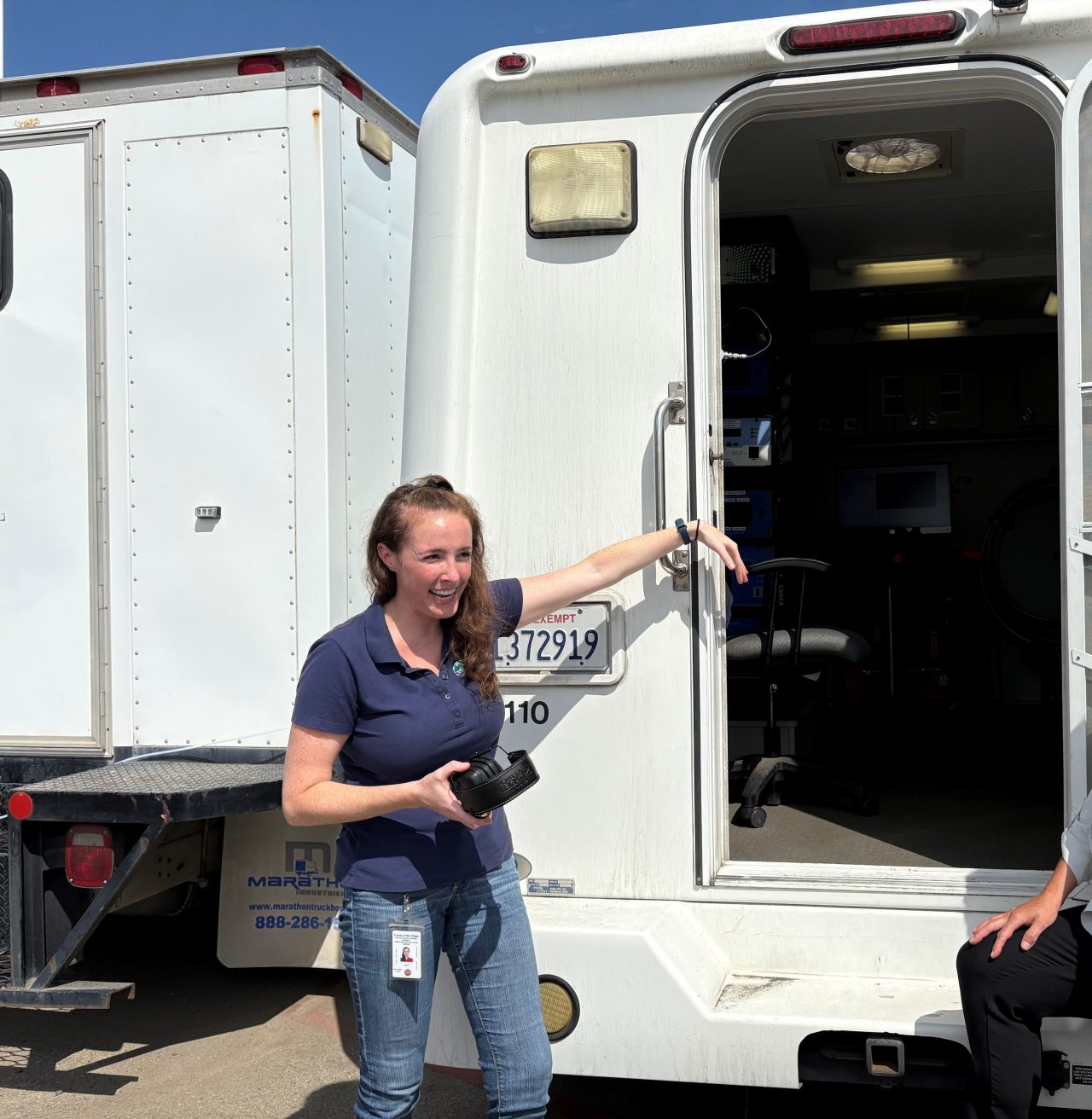 Woman in front of van