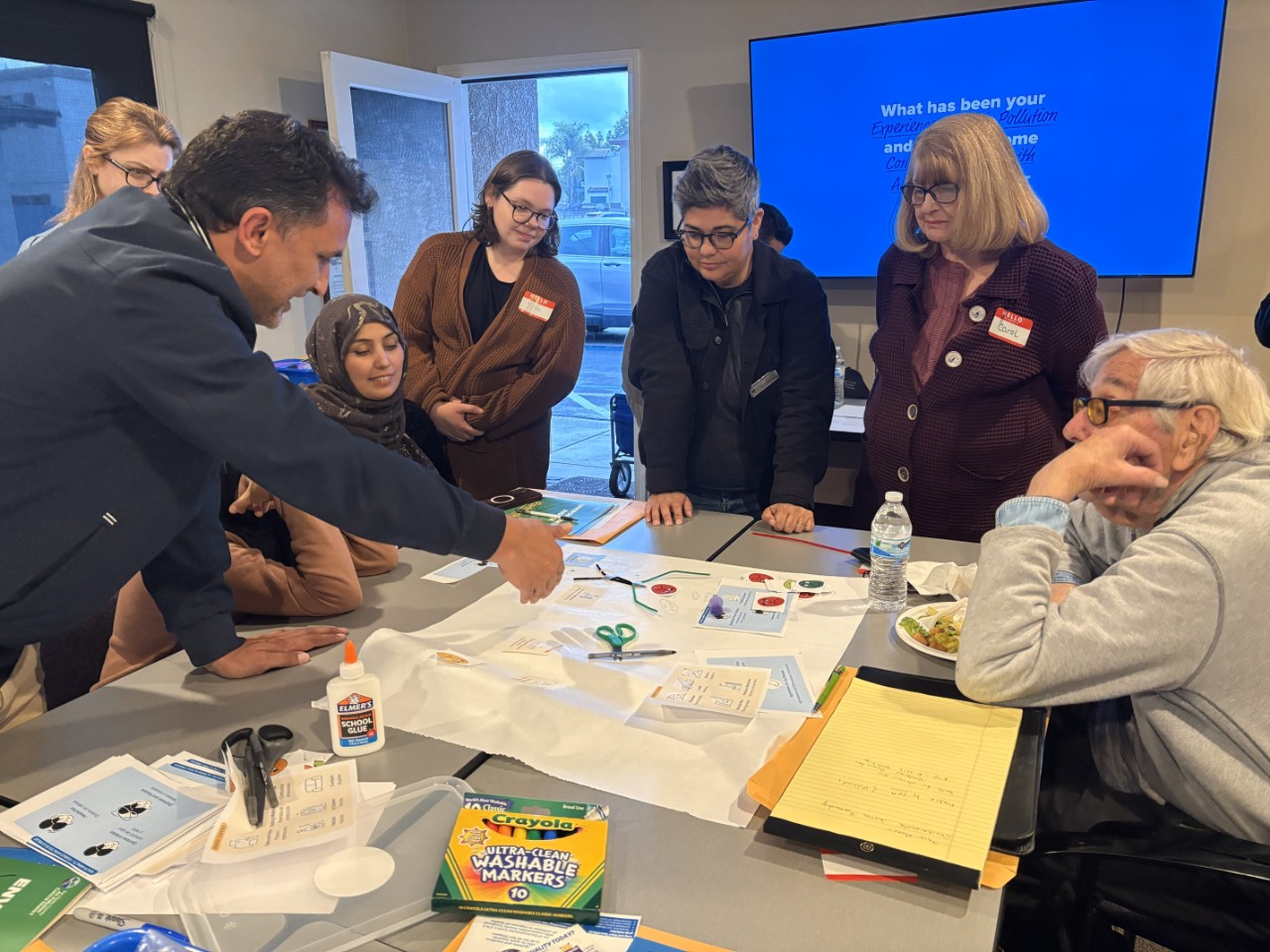 Environmental Justice Partnership staff and community members discuss air quality.